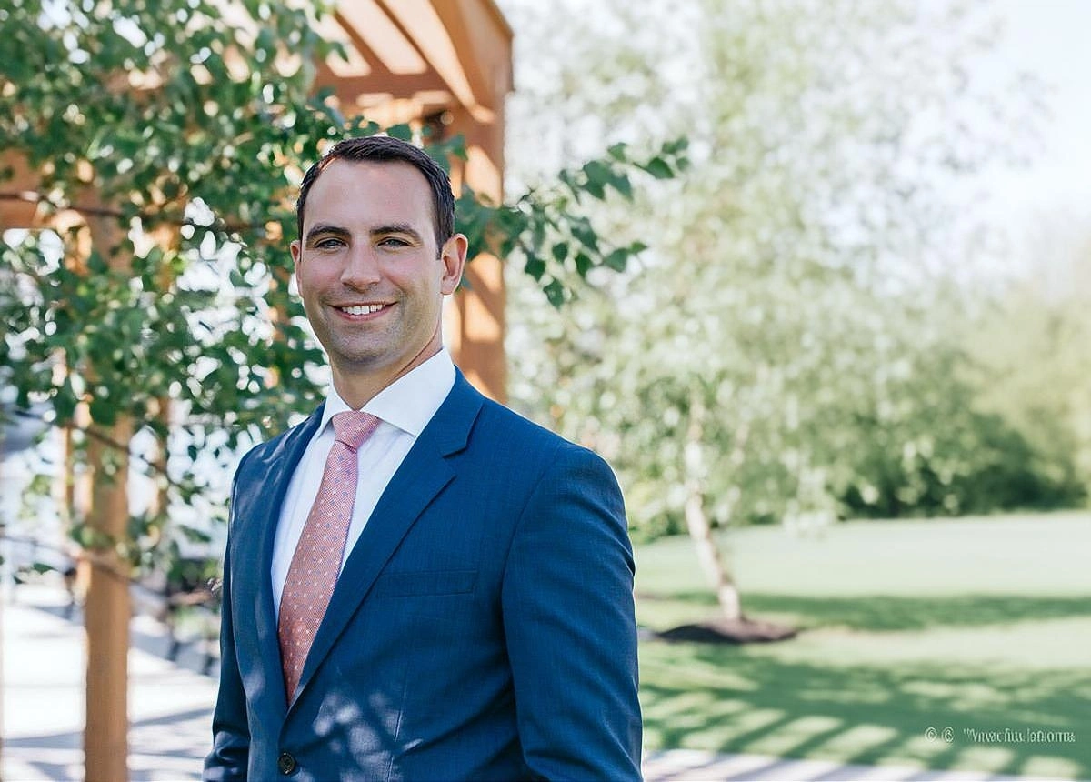 Jonathan Amoia outdoors in professional business attire